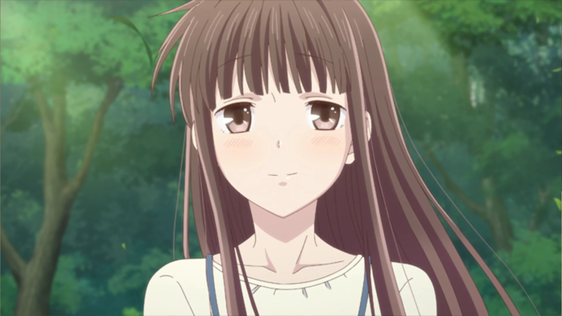 Tohru Honda from Fruits Basket with a kind smile, representing the Deredere archetype.